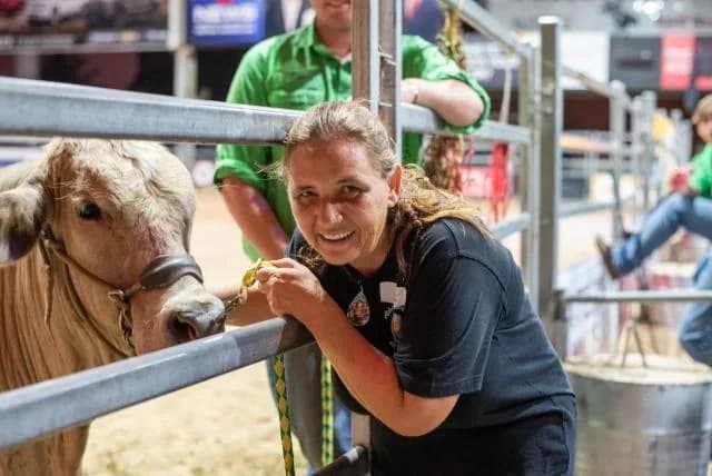 Founder Nathalie Grassi with a heifer at a cattle show